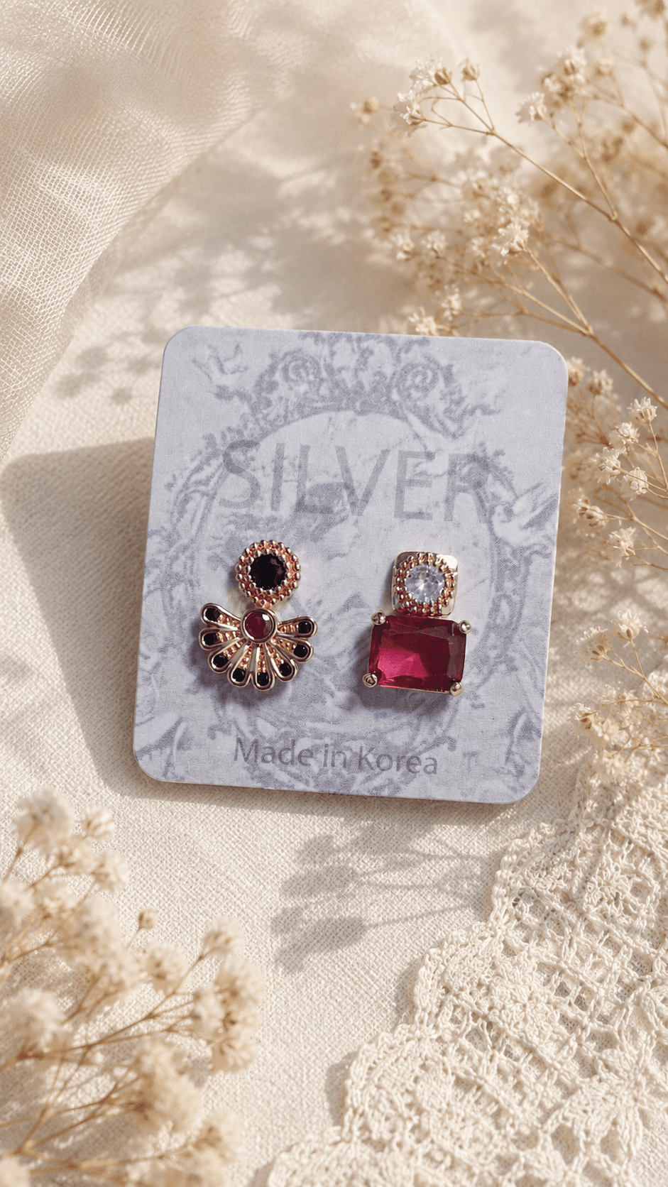 Rose gold cubic zirconia red stone asymmetrical earrings - 이미지 1